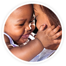 Child hugging mother's face