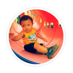 little boy in red gym toy